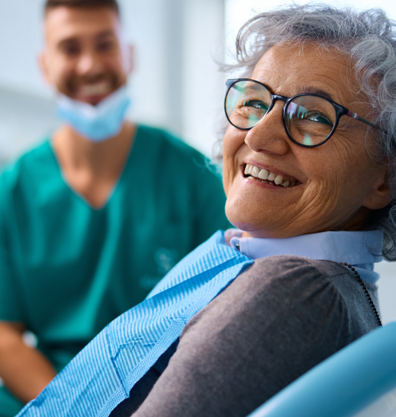 Smiling woman outside with healthy teeth